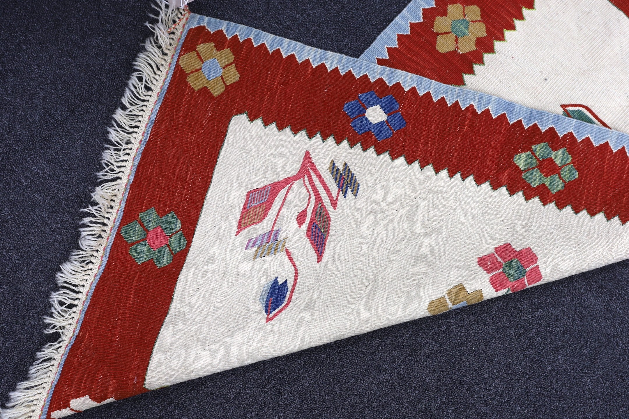 A Turkish floral mat, 100 x 60cm
